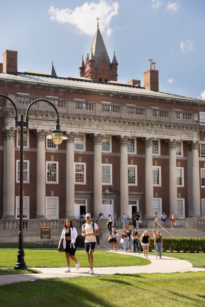 SU building exterior with students walking in front displayed in a new window