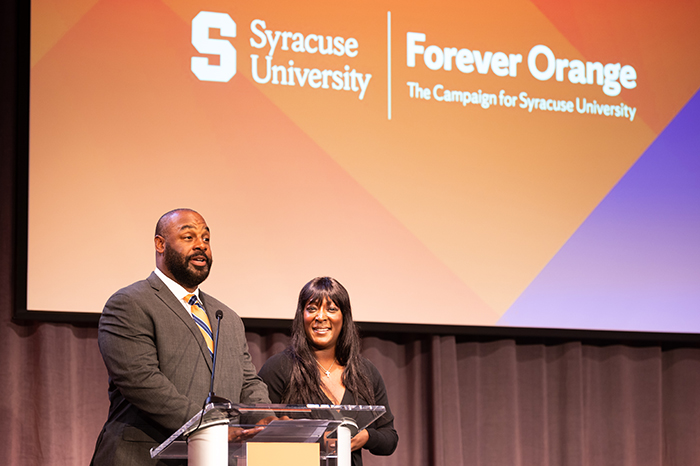 Our hosts, Life Trustee Donovan McNabb ’98 and Trustee Roxi McNabb ’98, G’99 welcome guests  displayed in a new window